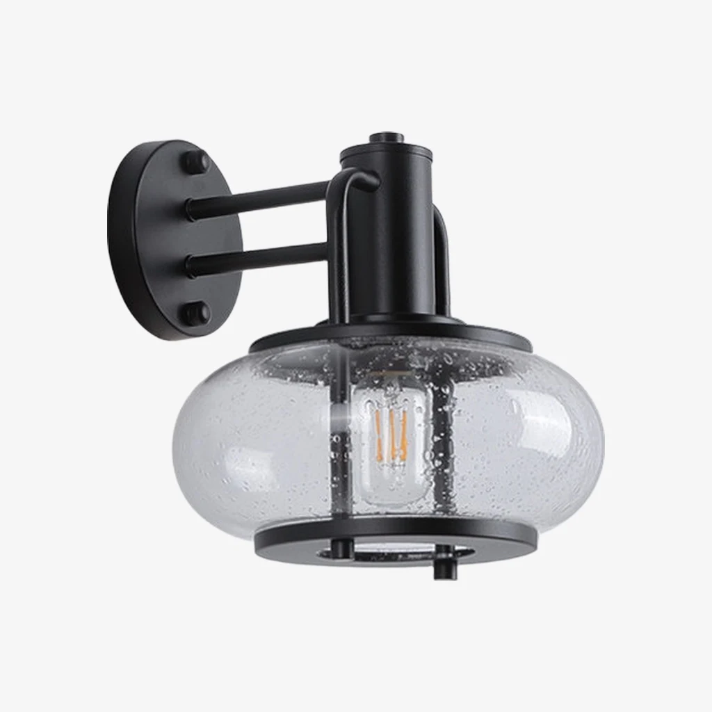 Black iron outdoor wall sconce with seeded glass cage shade on white background