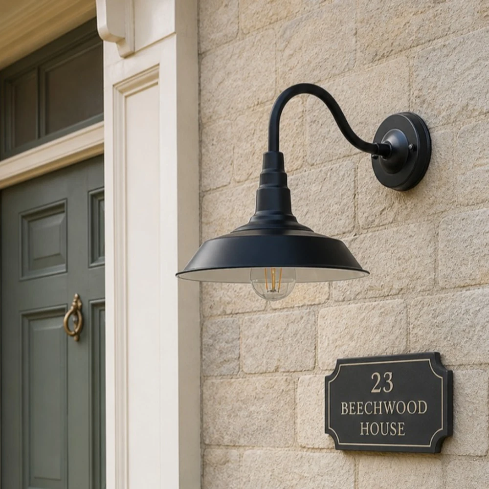 Black Solenvo gooseneck lamp on a brick exterior wall