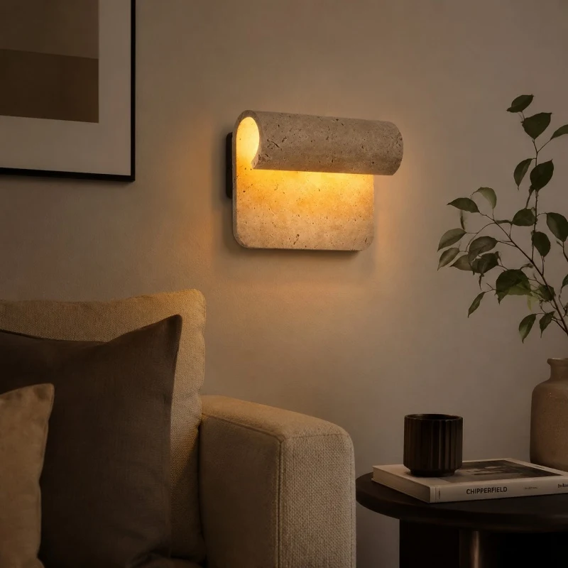 Travertine wall sconce in reading corner