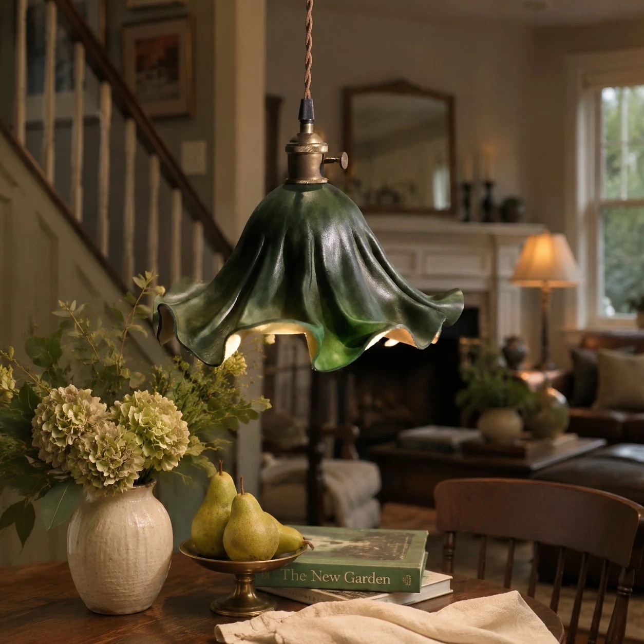 Dark green leather pendant light in a styled interior