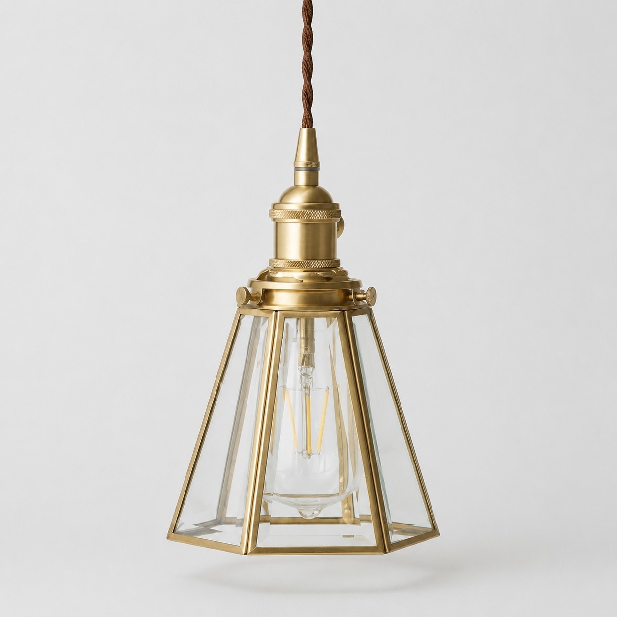 Clear glass pendant light with iron canopy