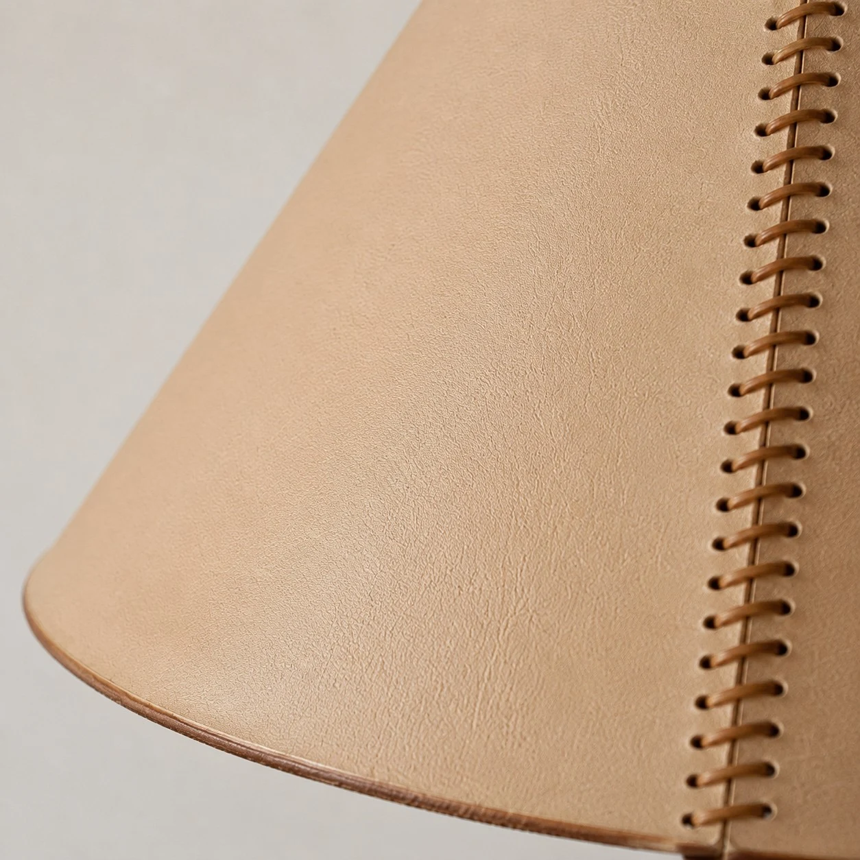 Close detail of stitched leather shade seam