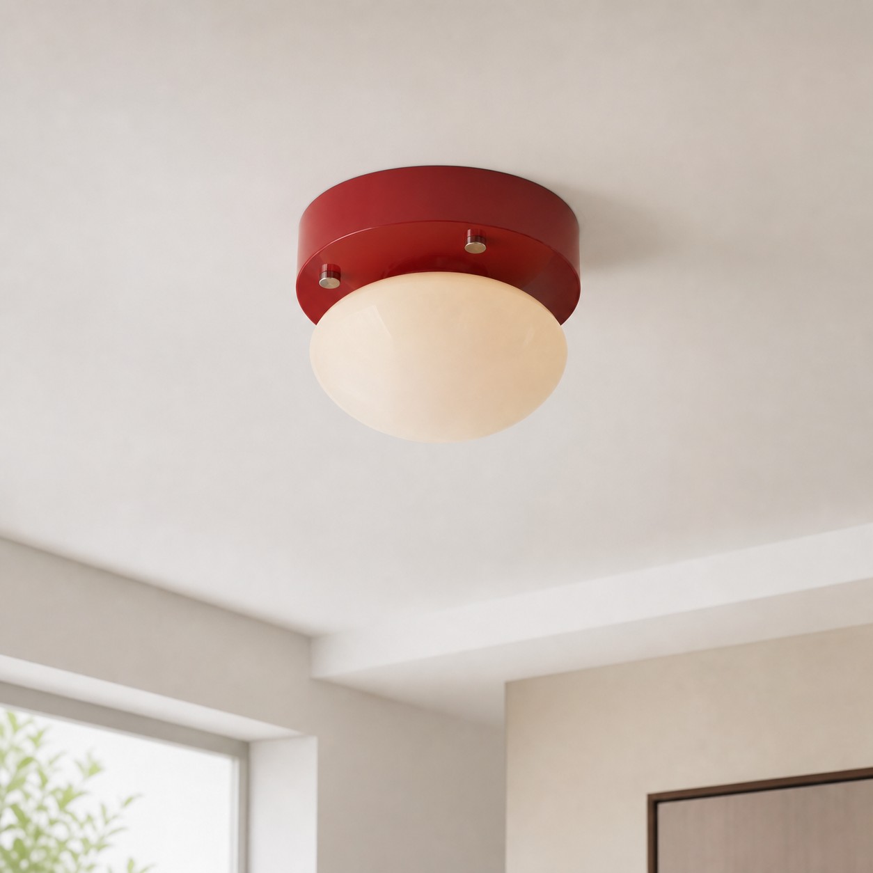 Red glass LED ceiling light installed in a compact neutral interior